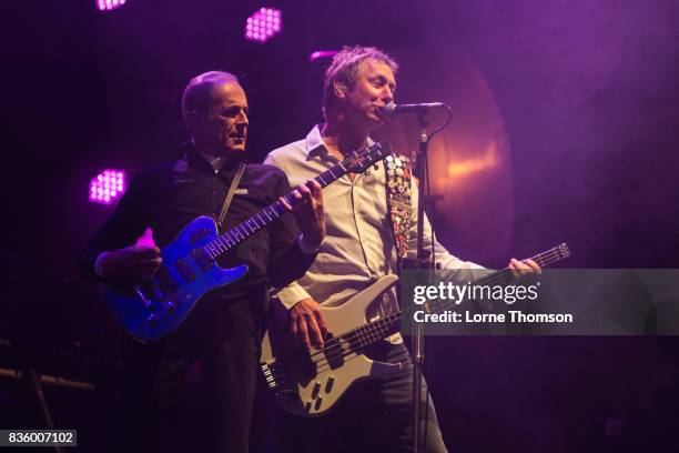 Francis Rossi and John "Rhino" Edwards of Status Quo perform at Rewind Festival on August 20, 2017 in Henley-on-Thames, England.