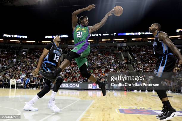 Kareem Rush of the 3 Headed Monsters attempts to make a pass over Rasual Butler of the Power in week nine of the BIG3 three-on-three basketball...