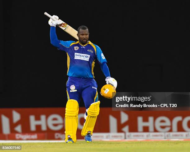 In this handout image provided by CPL T20, Dwayne Smith of Barbados Tridents celebrates his century during Match 19 of the 2017 Hero Caribbean...