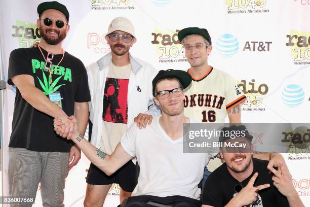 Jason Sechrist, John Gourley, Eric Howk, Kyle O'Quin and Zachary Carothers of the band Portugal. The Man pose at the Radio 104.5 Summer Block Party...