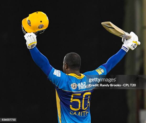 In this handout image provided by CPL T20, Dwayne Smith of Barbados Tridents celebrates his century during Match 19 of the 2017 Hero Caribbean...