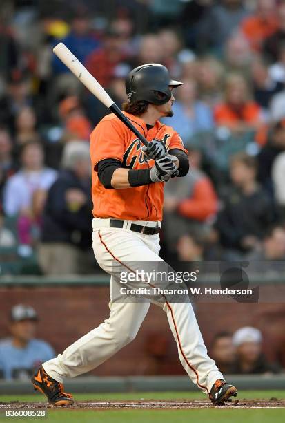 Jarrett Parker of the San Francisco Giants hits a two-run rbi double against the Philadelphia Phillies in the bottom of the first inning at AT&T Park...
