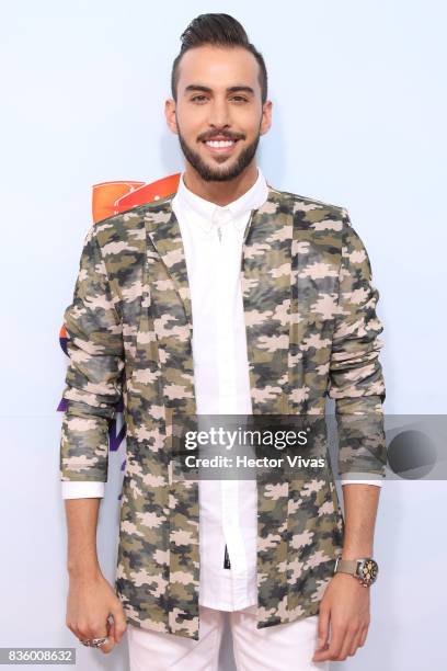 Roberto Carlo poses for pictures during the Kids Choice Awards Mexico 2017 Orange Carpet at Auditorio Nacional on August 19, 2017 in Mexico City,...