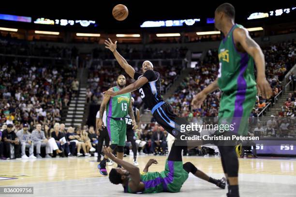 Jerome Williams of the Power tosses the ball up over Kareem Rush of the 3 Headed Monsters in week nine of the BIG3 three-on-three basketball league...