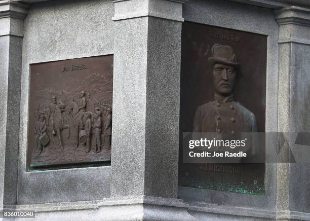 Plaques in honor of Confederates are seen on the base of a monument in Hemming Park in the midst of a national controversy over whether Confederate...