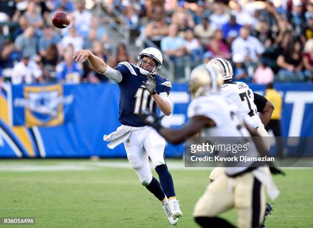 Quarterback Kellen Clemens of the Los Angeles Chargers throws a pass on the run against the New Orleans Saints during the first half of their...