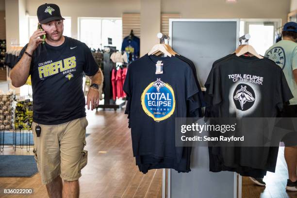 Man shops for eclipse themed t-shirts at Spirit Communications Park August 20, 2017 in Columbia, South Carolina. Columbia is one of the prime...