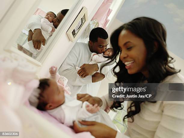 Sean Combs and Kim Porter at their home in New Jersey with twin baby daughters D'Lila Star and Jessie James on January 24, 2007. Credits: Kim...