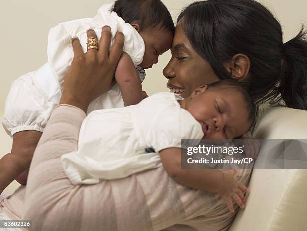 Kim Porter at home in New Jersey with her twin baby daughters D'Lila Star and Jessie James on January 24, 2007. Credits: Make up: Merrell Hollis/Ken...