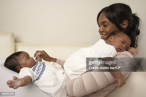 Kim Porter at home in New Jersey with her twin baby daughters D'Lila Star and Jessie James on January 24, 2007. Credits: Make up: Merrell Hollis/Ken...
