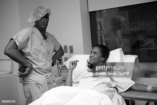 Sean Combs and Kim Porter before the birth of their twin daughters, Jessie James and D'Lila Star, on December 21, 2006 at Mt. Sinai hospital in New...