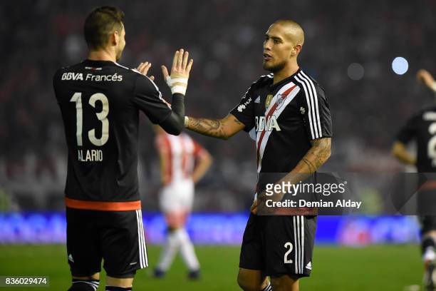 Jonatan Maidana of River Plate celebrates with teammate Lucas Alario after scoring the third goal of his team during a match between River Plate and...