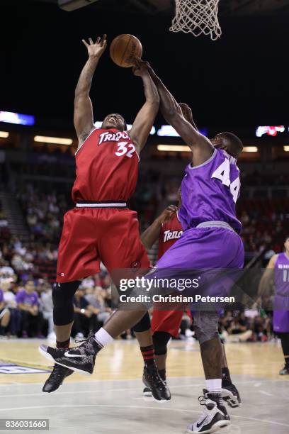 Rashad McCants of the Trilogy drives the ball against Ivan Johnson of the Ghost Ballers in week nine of the BIG3 three-on-three basketball league at...