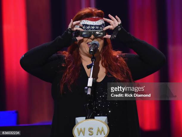 Wynonna Judd tries on her ECLIPSE glasses during Grand Ole Opry Total Eclipse 2017 Special Sunday Night Show at Grand Ole Opry House on August 20,...