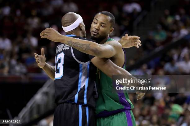 Jerome Williams of the Power and Rashard Lewis of the 3 Headed Monsters hug prior to the game in week nine of the BIG3 three-on-three basketball...