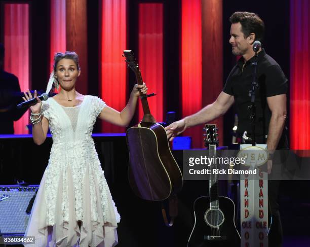 Singer/Songwriter/Actor Clare Bowen joins Singer/Songwriter/Actor Charles Esten on stage during Grand Ole Opry Total Eclipse 2017 Special Sunday...