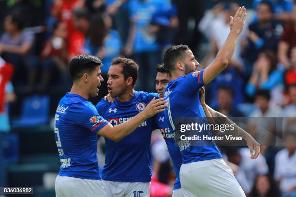 Edgar Mendez of Cruz Azul celebrates with teammates after scoring the first goal of his team during the fifth round match between Cruz Azul and Atlas...