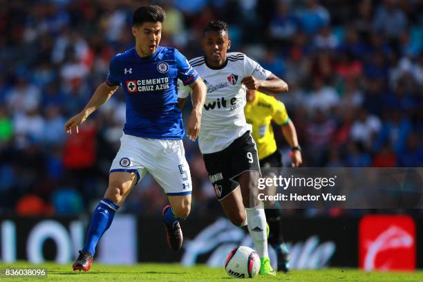 Francisco Silva of Cruz Azul struggles for the ball with Fidel Martinez of Atlas during the fifth round match between Cruz Azul and Atlas as part of...