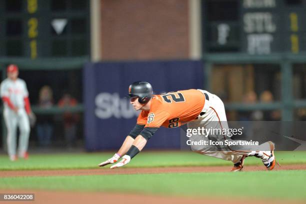 San Francisco Giants Catcher Buster Posey slides into second base during the San Francisco Giants versus Philadelphia Phillies game at AT&T Park on...