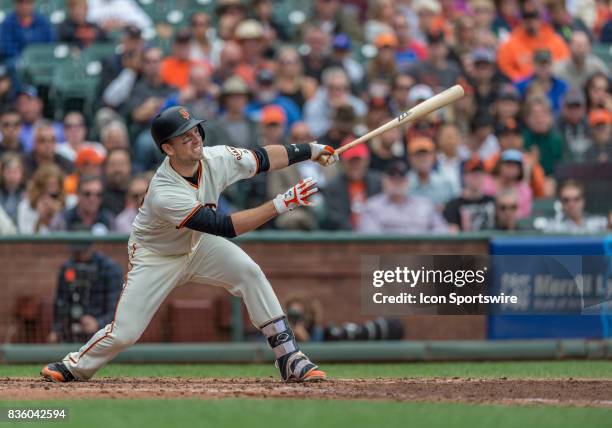 Buster Posey watches ball after he connects with pitch during the San Francisco Giants game versus the Chicago Cubs on August 9 at AT&T Park in San...