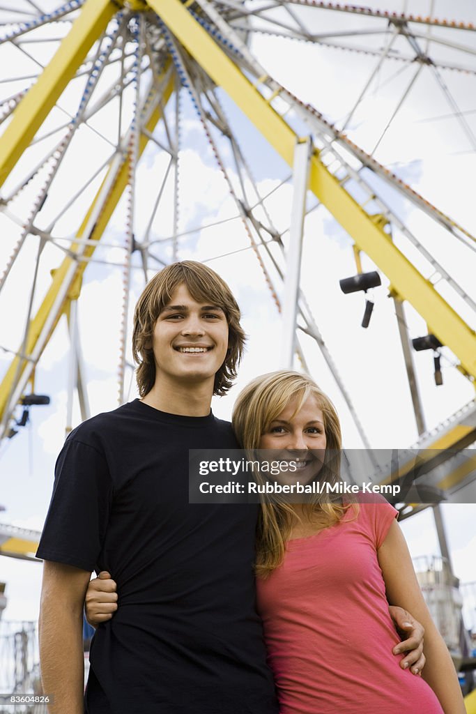 Young couple at an amusement park