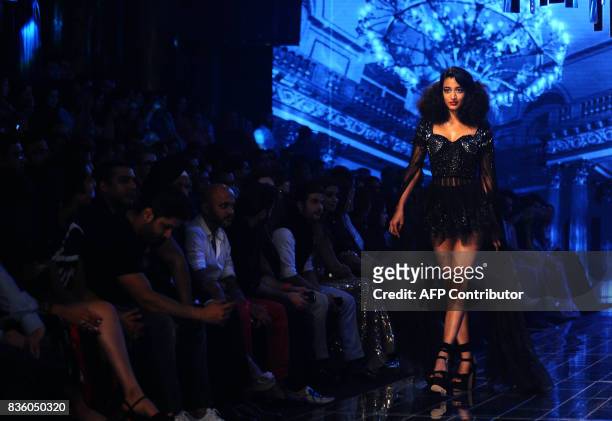 An Indian model showcases creations by designer Manish Malhotra during the grand finale of Lakme Fashion Week Winter/Festive 2017 in Mumbai on August...