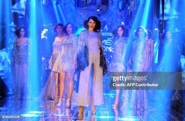 Indian models showcases creations by designer Manish Malhotra during the grand finale of Lakme Fashion Week Winter/Festive 2017 in Mumbai on August...