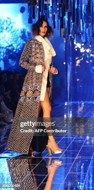 An Indian model showcases creations by designer Manish Malhotra during the grand finale of Lakme Fashion Week Winter/Festive 2017 in Mumbai on August...