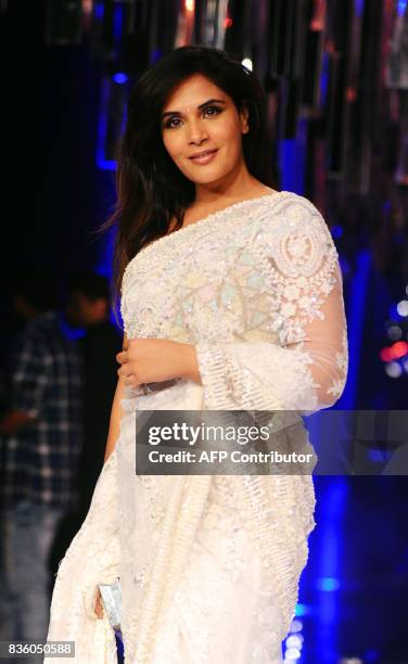 Indian Bollywood actress Richa Chadda poses for a photograph during the grand finale of Lakme Fashion Week Winter/Festive 2017 in Mumbai on August...