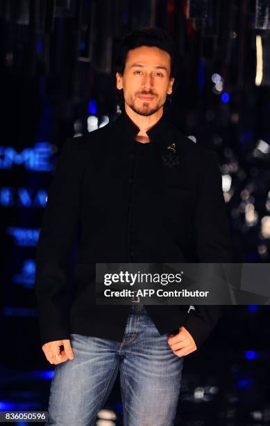 Indian Bollywood actor Tiger Shroff poses for a photograph during the grand finale of Lakme Fashion Week Winter/Festive 2017 in Mumbai on August 20,...