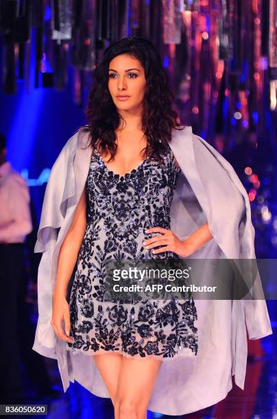 Indian Bollywood actress Amyra Dastur poses for a photograph during the grand finale of Lakme Fashion Week Winter/Festive 2017 in Mumbai on August...