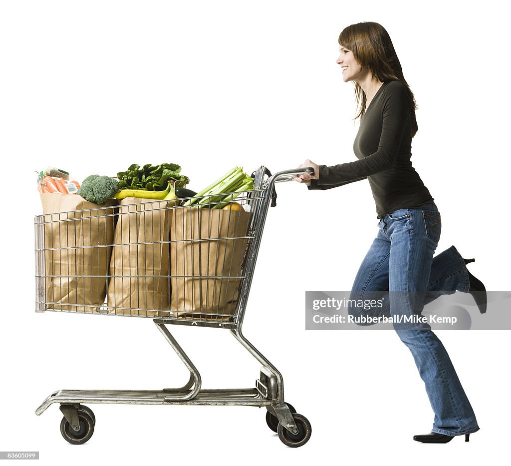 Woman pushing a shopping cart