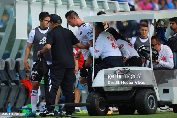 Milton Caraglio of Atlas leaves the field after being injured during the fifth round match between Cruz Azul and Atlas as part of the Torneo Apertura...