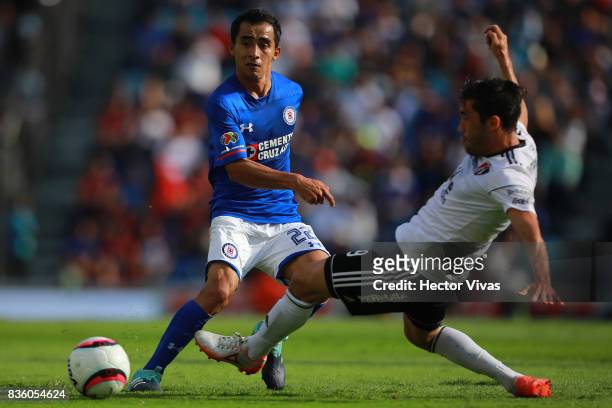 Rafael Baca of Cruz Azul struggles for the ball with Juan Vigon of Atlas during the fifth round match between Cruz Azul and Atlas as part of the...