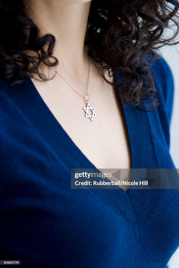 Woman wearing a star of david necklace