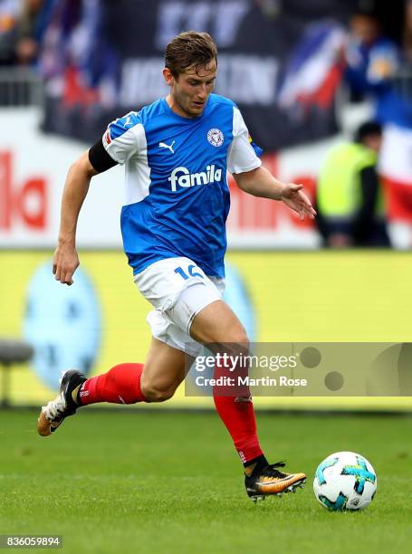 Christopher Lenz of Kiel runs with the ball during the Second Bundesliga match between Holstein Kiel and SpVgg Greuther Fuerth at Holstein-Stadion on...