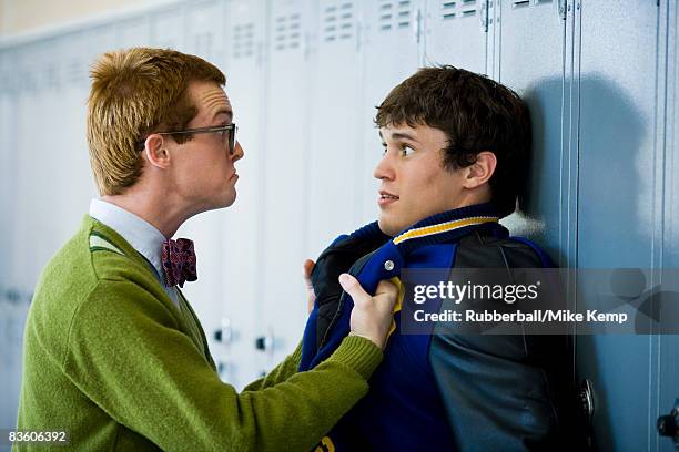 nerd picking on jock. - hazing stock pictures, royalty-free photos & images