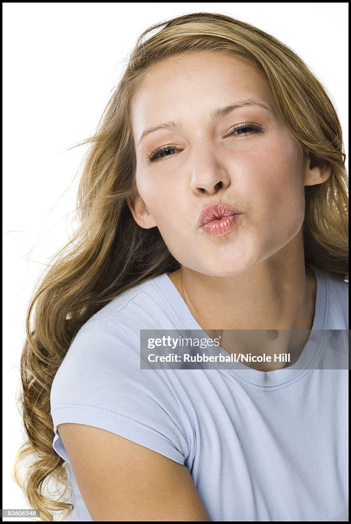 Young woman in a gray shirt.