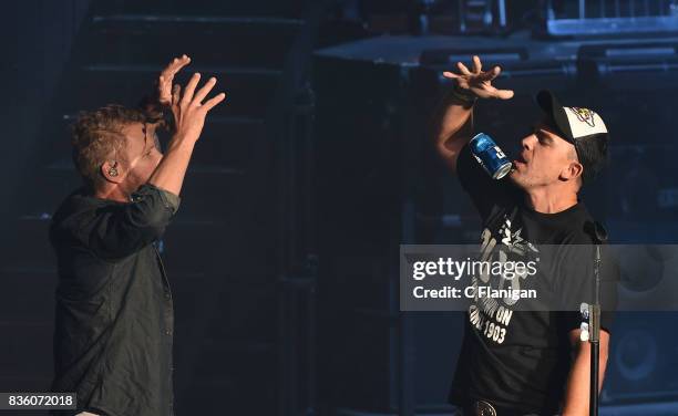 Dierks Bentley brings a fan onstage to 'shotgun' a beer during his 'What The Hell' world tour at Shoreline Amphitheatre on August 20, 2017 in...