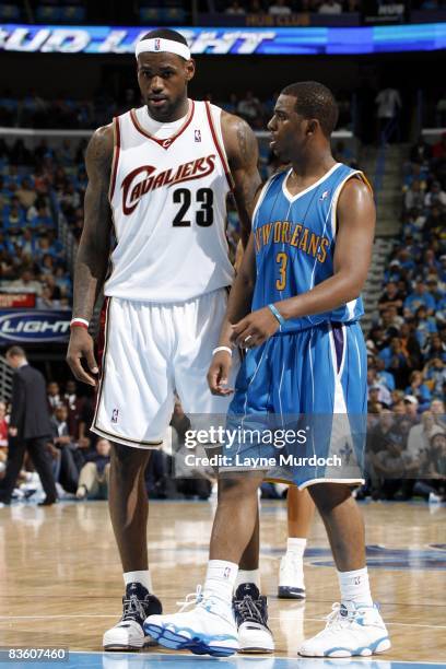 Chris Paul of the New Orleans Hornets walks by LeBron James of the Cleveland Cavaliers during the game at the New Orleans Arena on November 1, 2008...