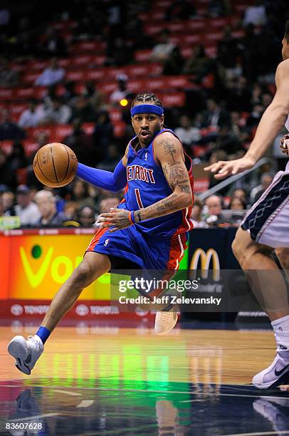 Allen Iverson of the Detroit Pistons drives past Brook Lopez of the New Jersey Nets during their game November 7, 2008 at the Izod Arena in East...