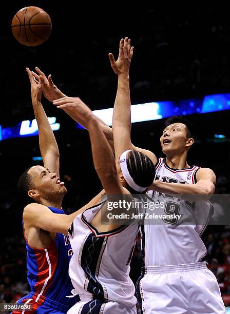 Josh Boone and Yi Jianlian guard Tayshaun Prince of the Detroit Pistons during their game November 7, 2008 at the Izod Arena in East Rutherford, New...