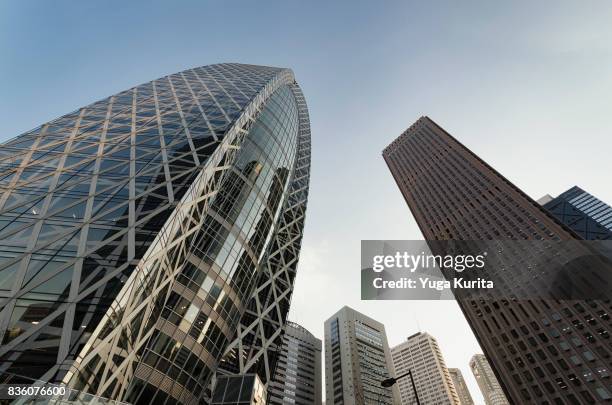 looking up skyscrapers in shinjuku - mode gakuen cocoon tower stock pictures, royalty-free photos & images