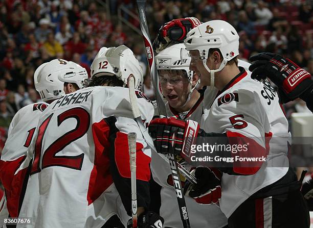 Mike Fisher of the Ottawa Senators celebrates his second-period goal with teammates during their NHL game against the Carolina Hurricanes on November...
