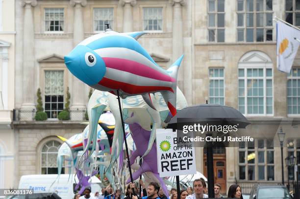 Greenpeace protestors arrive in St. Jame's Square at the BP headquarters as they take part in a parade of inflatable sea creatures on August 21, 2017...