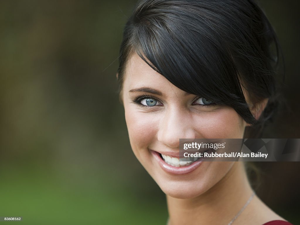 Young woman smiling.