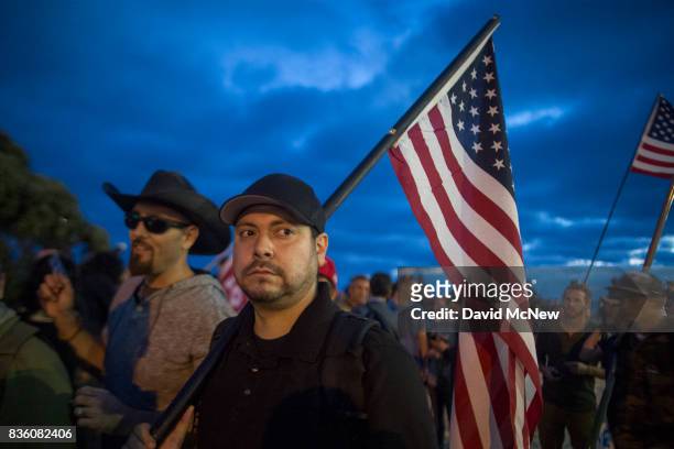Conservative demonstrators rally at an 'America First' demonstration on August 20, 2017 in Laguna Beach, California. Organizers of the rally describe...
