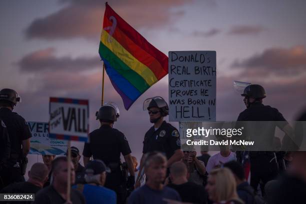 Police form a line to keep demonstrators and counter demonstrators apart at an 'America First' demonstration on August 20, 2017 in Laguna Beach,...