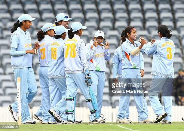 Amita Sharma of India is congratulated after claiming a wicket during the 4th Women's One Day International match between Australia and India at...