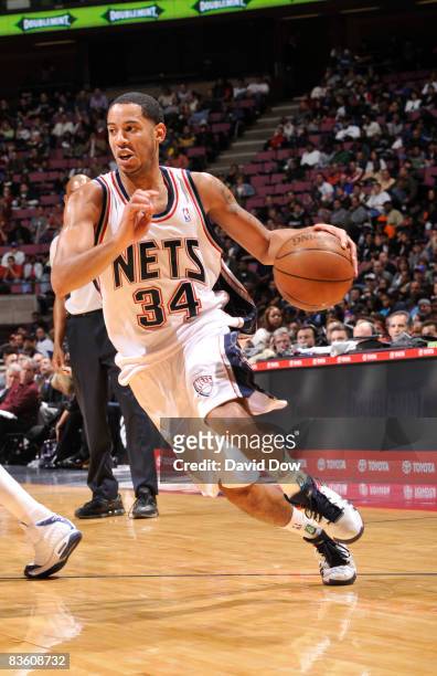 Devin Harris of the New Jersey Nets drives against the Detroit Pistons on November 7, 2008 at the IZOD Center in East Rutherford, New Jersey. NOTE TO...